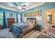 Inviting bedroom with blue walls, tray ceiling, ceiling fan, and window at 4333 Deer Ridge Ct, Lilburn, GA 30047