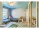 Cozy bedroom with a ceiling fan, closet with mirrored doors, and a window for natural light at 4333 Deer Ridge Ct, Lilburn, GA 30047