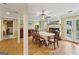 Elegant dining room with hardwood floors, ceiling fan, adjacent to the kitchen and living areas at 4333 Deer Ridge Ct, Lilburn, GA 30047