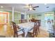 Traditional dining room boasts ample space, hardwood floors, neutral green walls, and views into the foyer and other living areas at 4333 Deer Ridge Ct, Lilburn, GA 30047
