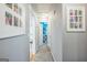 Inviting hallway featuring soft gray walls and plush carpeting, leading to various rooms in the home at 4333 Deer Ridge Ct, Lilburn, GA 30047