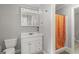 Bright bathroom with white vanity, updated fixtures, and a shower featuring a colorful shower curtain at 3313 Henson Ln, Stockbridge, GA 30281