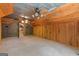 This versatile bonus room features wood paneled walls and ceiling, brick accents, and neutral carpeting at 3313 Henson Ln, Stockbridge, GA 30281
