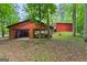 Exterior of a property with multiple garages, offering ample parking and storage space at 3313 Henson Ln, Stockbridge, GA 30281
