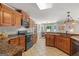 Spacious kitchen featuring custom wood cabinetry, countertops, and appliances at 3313 Henson Ln, Stockbridge, GA 30281