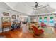 Bright living room with wood floors connects to dining area and outdoor pool area at 3313 Henson Ln, Stockbridge, GA 30281