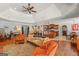 Open concept living room flows into the kitchen with warm tones and cozy seating arrangements at 3313 Henson Ln, Stockbridge, GA 30281