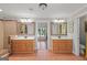 Main bathroom with dual sinks, vanities, ornate mirrors, and a separate shower stall at 3313 Henson Ln, Stockbridge, GA 30281