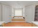 Large tub and bathroom, with closets and tiled floors at 3313 Henson Ln, Stockbridge, GA 30281