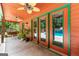 Covered patio featuring ceiling fans, offering a comfortable space with views of the pool area at 3313 Henson Ln, Stockbridge, GA 30281