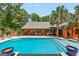 Spacious pool area with a covered patio, perfect for outdoor entertaining and relaxation at 3313 Henson Ln, Stockbridge, GA 30281