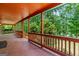 Wide porch perfect for outdoor relaxation with porch swing and wooded view at 3313 Henson Ln, Stockbridge, GA 30281