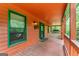 Inviting porch with wood floors, offering space for relaxation with an outdoor view at 3313 Henson Ln, Stockbridge, GA 30281