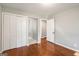 Cozy bedroom with hardwood floors, closet, and two doors at 765 Shellnut Dr, Forest Park, GA 30297