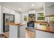 Charming kitchen with stainless steel appliances, and eat-in kitchen island at 765 Shellnut Dr, Forest Park, GA 30297