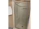 Bathroom featuring a glass-enclosed shower and towel rack at 201 Summerford Pl, Stockbridge, GA 30281