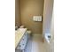Bathroom with white tile flooring, a vanity, toilet, and a tub at 201 Summerford Pl, Stockbridge, GA 30281