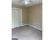 Bedroom featuring neutral walls, carpeted floors, and a double-door closet at 201 Summerford Pl, Stockbridge, GA 30281