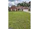 Charming single-story brick home featuring an attached two-car garage and a well-maintained lawn at 201 Summerford Pl, Stockbridge, GA 30281