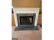 Close up of fireplace with white mantle and marble hearth in living room at 201 Summerford Pl, Stockbridge, GA 30281