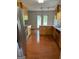 Open kitchen with stainless steel appliances, quartz countertops, wood floors, and ample cabinet space at 201 Summerford Pl, Stockbridge, GA 30281