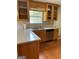 Kitchen showcasing stainless steel appliances, wooden cabinets, quartz countertops, and a stainless steel sink at 201 Summerford Pl, Stockbridge, GA 30281