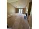 Open living room features a vaulted ceiling, neutral paint, and a fireplace at 201 Summerford Pl, Stockbridge, GA 30281