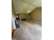 Spacious living room with fireplace, high ceilings, and neutral-colored walls and carpet at 201 Summerford Pl, Stockbridge, GA 30281