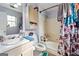 Functional bathroom featuring a shower-tub combo and a vanity with storage at 2804 Davis Mill N Rd, Dallas, GA 30157