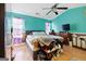 Comfortable bedroom with bright blue walls, ceiling fan, and wood-like floors at 2804 Davis Mill N Rd, Dallas, GA 30157
