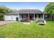 Charming single-story home featuring a covered front porch and two-car garage at 2804 Davis Mill N Rd, Dallas, GA 30157