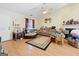 Cozy living room with wood flooring, a ceiling fan, and a traditional fireplace at 2804 Davis Mill N Rd, Dallas, GA 30157