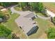 Stunning aerial view of a home with lush landscaping and a winding driveway at 411 Johnson Rd, Locust Grove, GA 30248