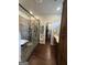 A luxurious bathroom features a glass enclosed shower and double vanity with wood cabinets at 411 Johnson Rd, Locust Grove, GA 30248