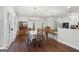 Open dining area featuring hardwood floors and an eat-in bar at 411 Johnson Rd, Locust Grove, GA 30248