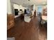 Spacious kitchen boasts a large island, black appliances, and stylish countertops, perfect for cooking and entertaining at 411 Johnson Rd, Locust Grove, GA 30248