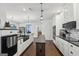 Gourmet kitchen with stone countertops, white cabinets, island and stainless steel appliances at 411 Johnson Rd, Locust Grove, GA 30248
