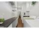 Long laundry room with machines and countertop at 411 Johnson Rd, Locust Grove, GA 30248