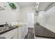 Functional laundry room with counter space, sink, and appliances at 411 Johnson Rd, Locust Grove, GA 30248
