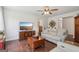 Living room featuring hardwood floors, neutral walls, and comfortable seating with a TV at 411 Johnson Rd, Locust Grove, GA 30248