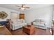 Comfortable living room with hardwood floors, a ceiling fan, and plush seating at 411 Johnson Rd, Locust Grove, GA 30248