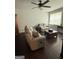 Comfortable living room with dark hardwood floors, neutral paint, and ceiling fan at 411 Johnson Rd, Locust Grove, GA 30248