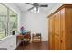 Bright office featuring built in storage with a ceiling fan and natural light at 411 Johnson Rd, Locust Grove, GA 30248
