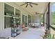 Relaxing outdoor porch area featuring ceiling fans and potted plants at 411 Johnson Rd, Locust Grove, GA 30248