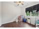 Room with hardwood floors and a window that brings in natural light at 411 Johnson Rd, Locust Grove, GA 30248