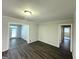 Spacious living room features wood floors, neutral colored walls, and abundant natural light at 4487 Greenleaf Sw Cir, Atlanta, GA 30331