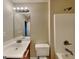 Bathroom with a white countertop sink and shower-tub combo at 330 Bentleigh Station Dr, Acworth, GA 30101