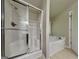Bathroom with shower and a soaking tub with a window at 330 Bentleigh Station Dr, Acworth, GA 30101