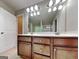 Bathroom boasts a double sink vanity with wood cabinetry and modern lighting at 330 Bentleigh Station Dr, Acworth, GA 30101