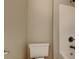 Bright bathroom featuring a toilet and a shower with bronze hardware at 330 Bentleigh Station Dr, Acworth, GA 30101